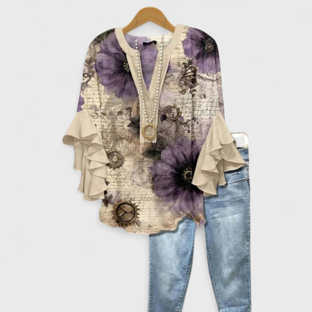 Izabell – Blus med eleganta blommönster