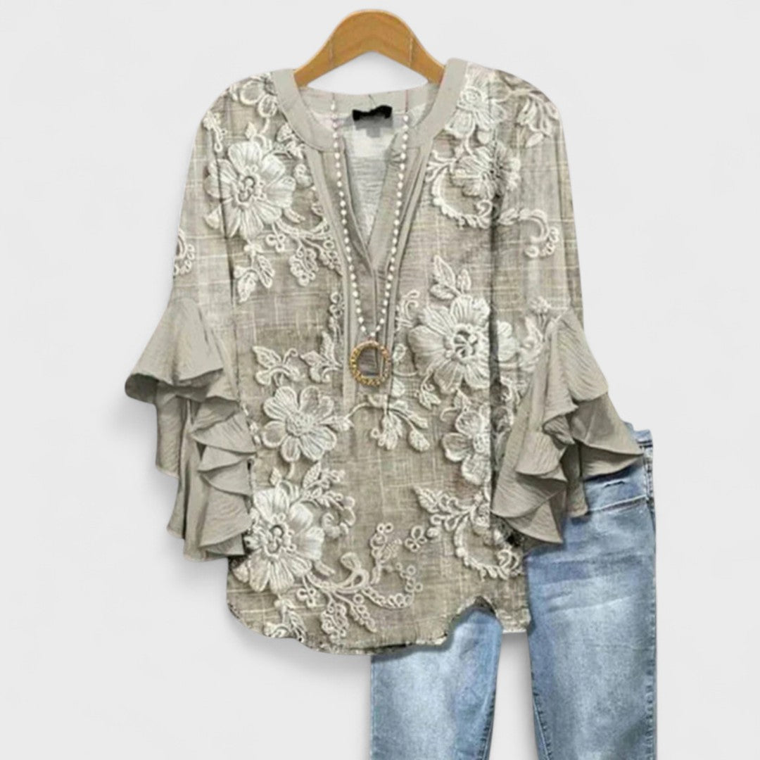 Izabell – Blus med eleganta blommönster