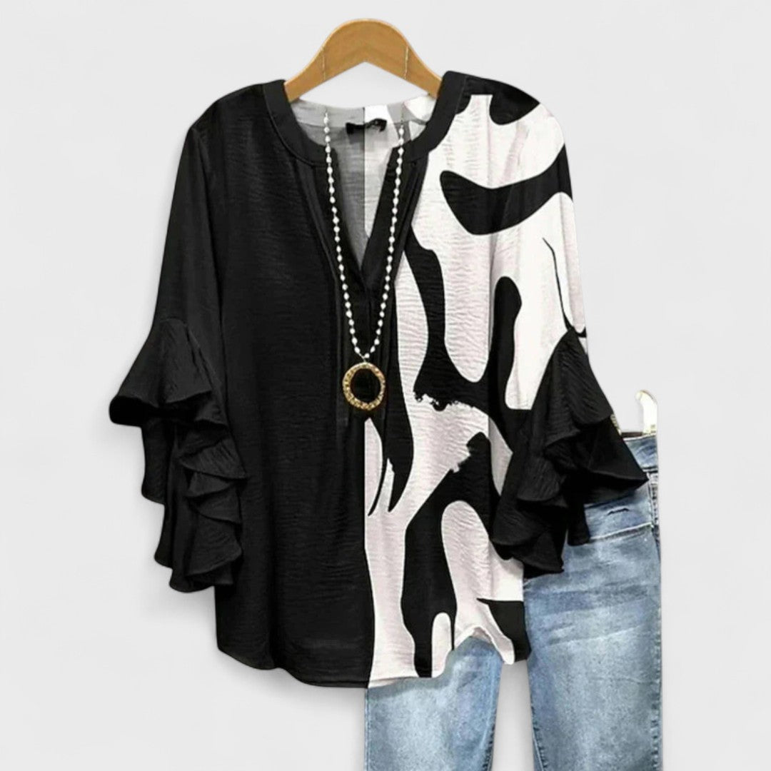 Izabell – Blus med eleganta blommönster